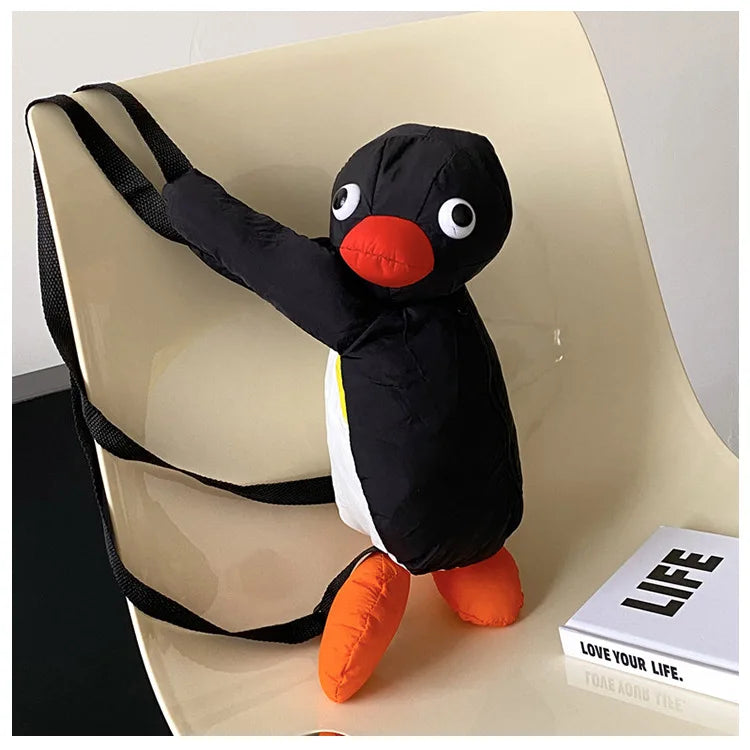 stuffed-penguin-backpack-view-on-a-chair