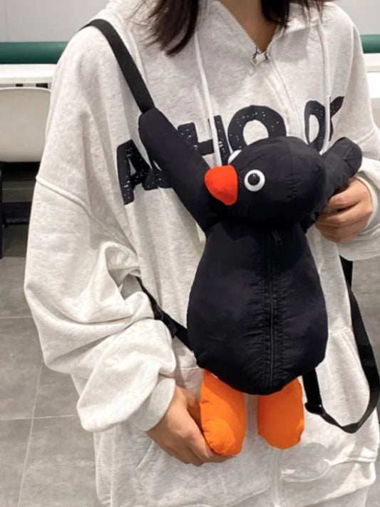 Female-wearing-stuffed-penguin-backpack-on-the-front